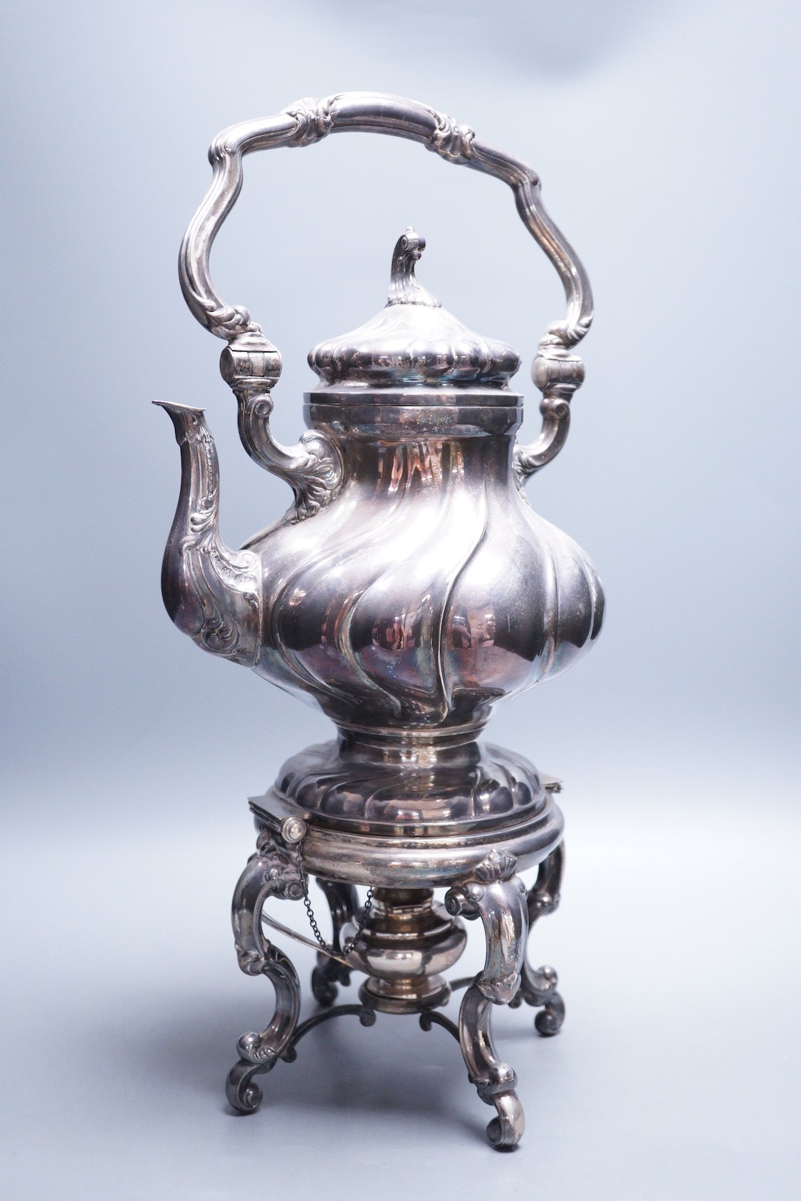 A late 19th century Italian 800 standard white metal tea kettle on stand with burner, of spiral pear form, makers mark AL 1, overall height 48.5cm